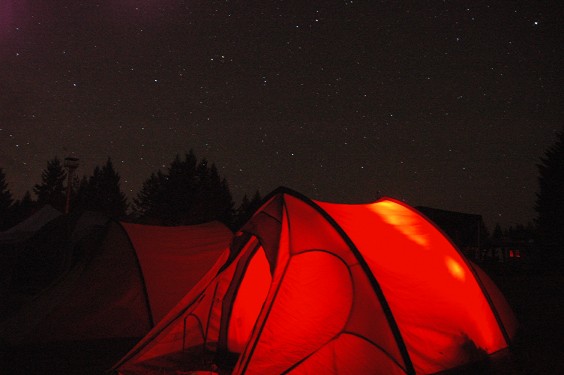 Dark skies over red tent