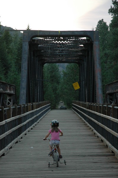 Jessica riding bike on Kettle Valley Railway